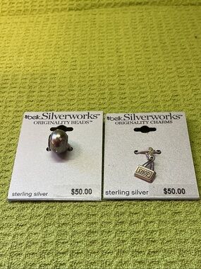 Belk Silverworks Sterling Silver Shop Charms. Includes 2 charms.